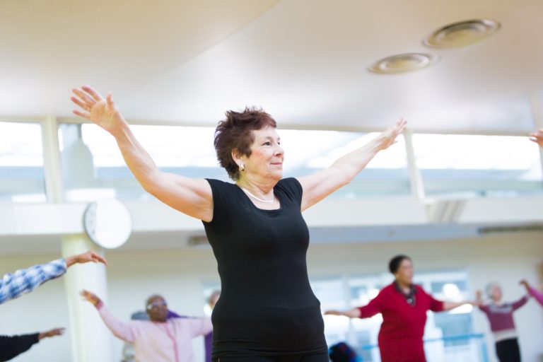 Woman doing physical activity during a sitting netball session