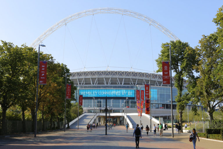 Image of people walking on street leading to Wembley Stadium