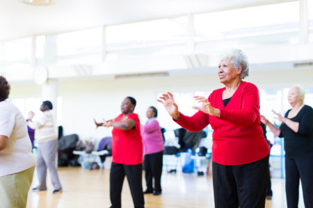 Older women taking part in a dance exercise class