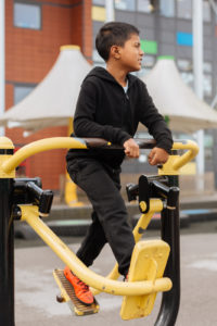 Young boy doing physical activity during school break