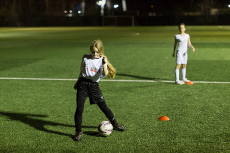 Girl playing football during This Girl Can Campaign