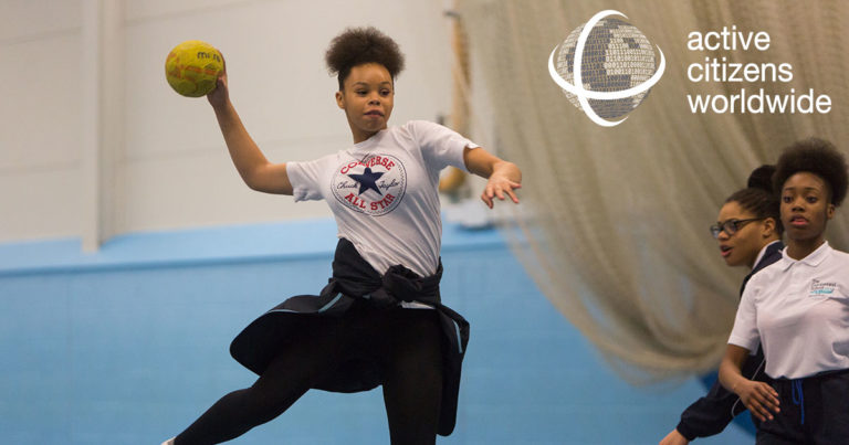 Girl playing handball in indoor leisure facility